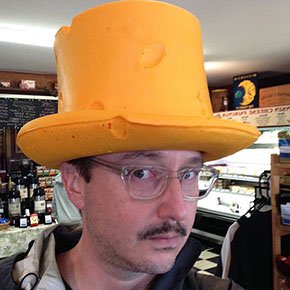 here's a picture of John Hodgman in a cheesehead hat