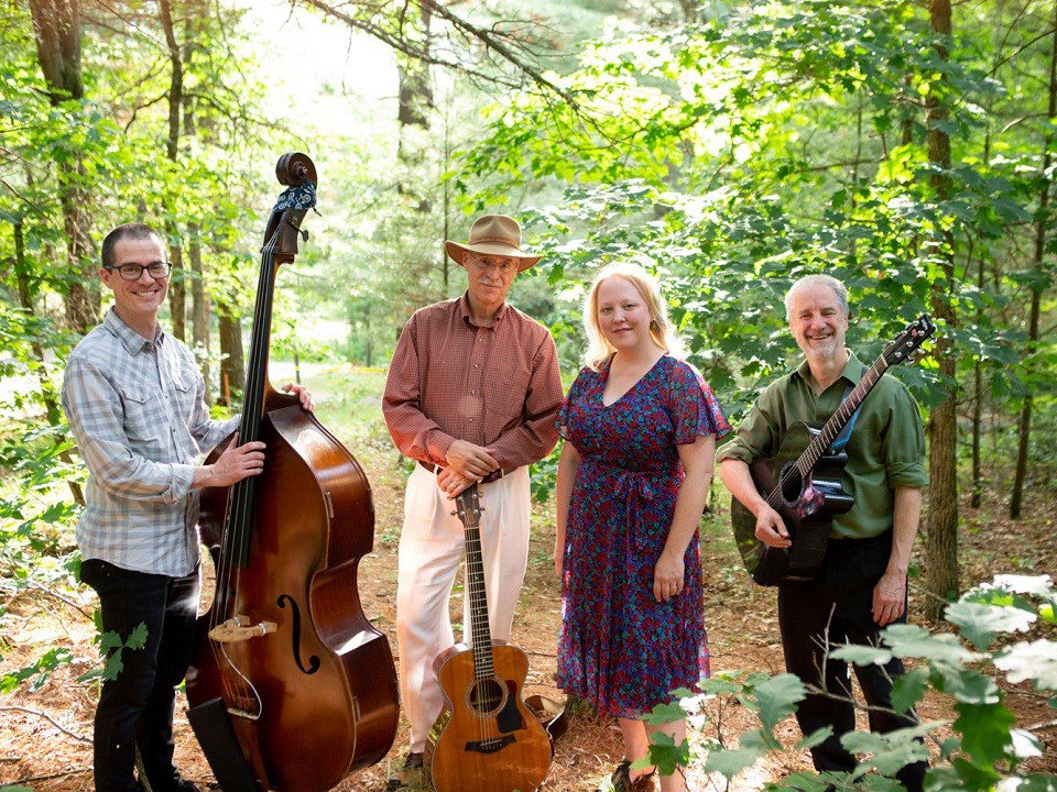 The Honey Pies in a clearing in the woods.