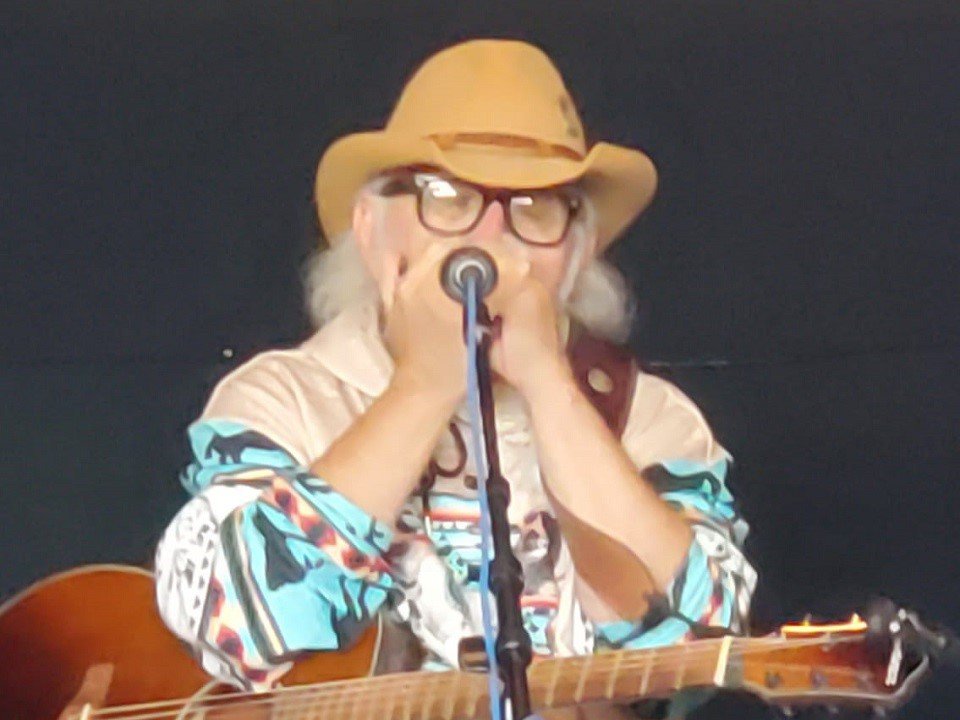 Durango McMurphy playing harmonica.