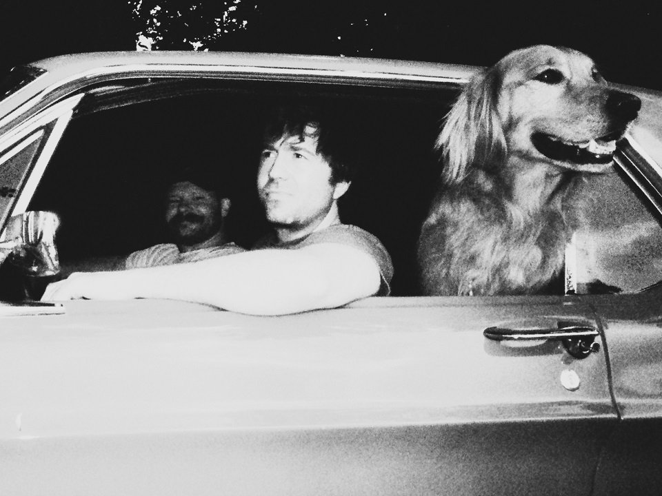 Penny and Sparrow (and friend) in a vintage car.