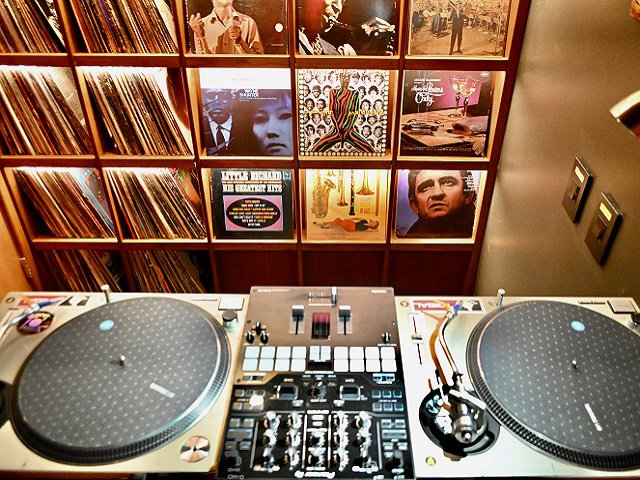 Two turntables and vinyl records.