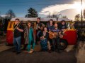 The band La Combi in front of a VW van.