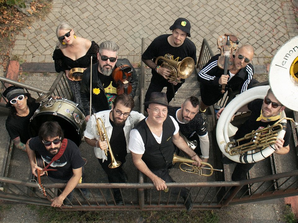 Lemon Bucket Orkestra on a staircase.