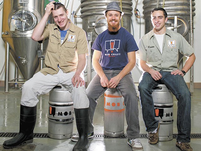 Overseeing the mob: Brewers Andrew Gierczak, Henry Schwartz and Giotto Troia.