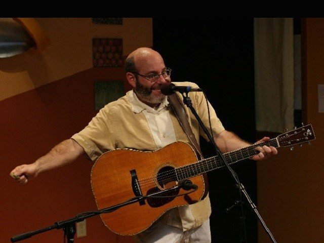 David Landau with guitar.