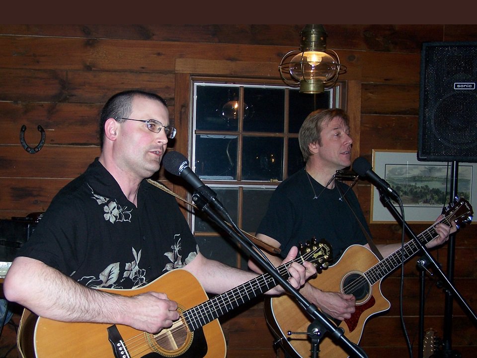 Casey and Greg on stage.