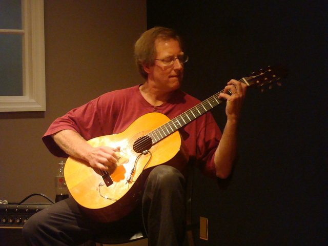 A man with a guitar.