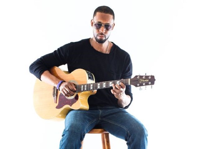 Adem Tesfaye and guitar.