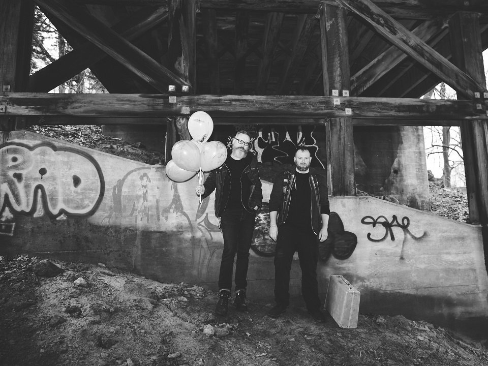 Daughters of Saint Crispin under a bridge.