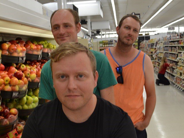 The three members of Pollinators in the produce aisle.