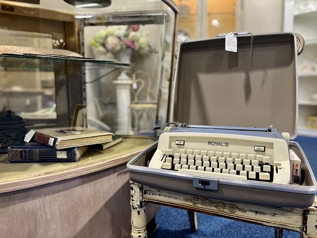 A manual Royal typewriter and other collectibles.