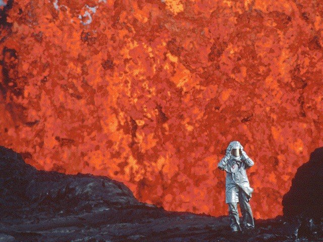 Katia Krafft wearing an aluminized suit near a lava burst.