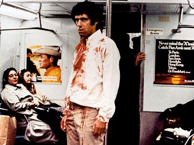 Elliott Gould with a bloody shirt on the subway.