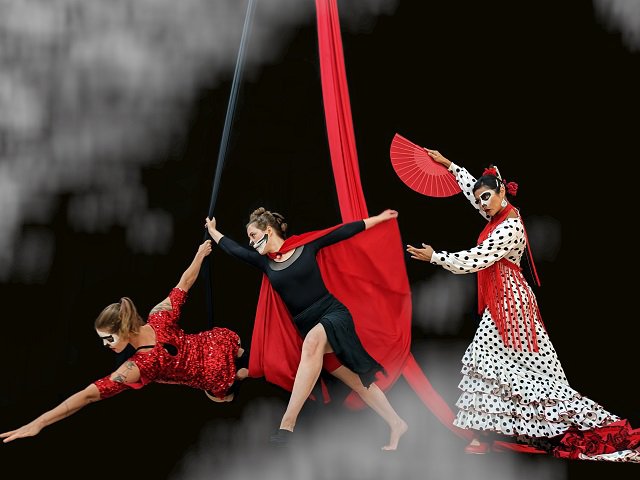 Costumed dancers on a set.