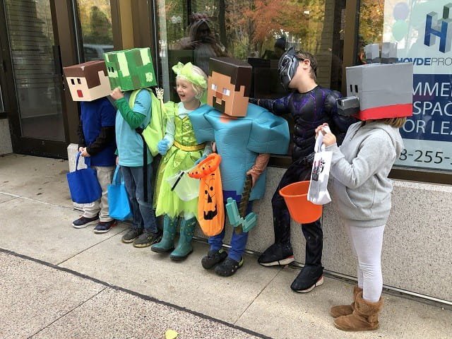 A group of kids in Halloween costumes.