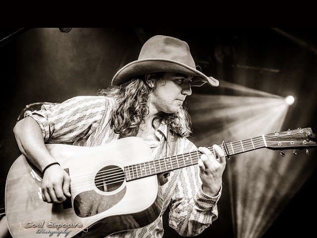 Ben Majeska with an acoustic guitar.