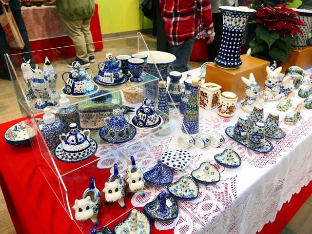 A table filled with blue and white ceramics.