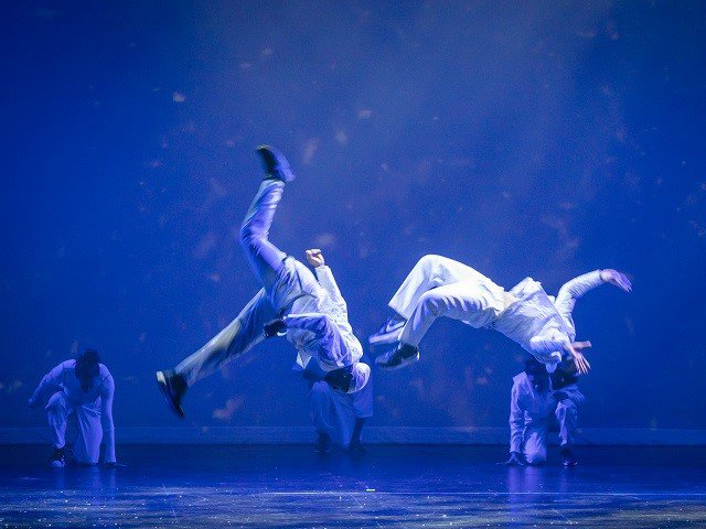 Dancers suspended in mid-air.