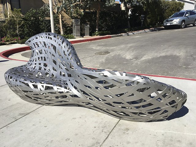 Artistic wavy stainless steel seating bench