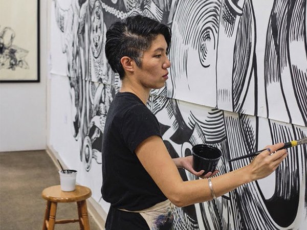 Jenie Gao at work on a painting.