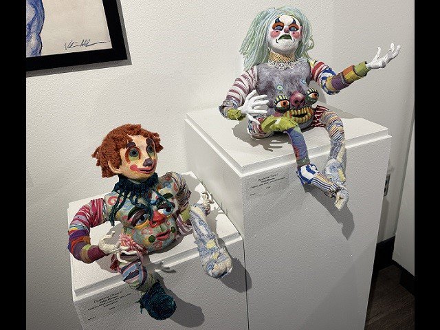 Two art works of clowns.