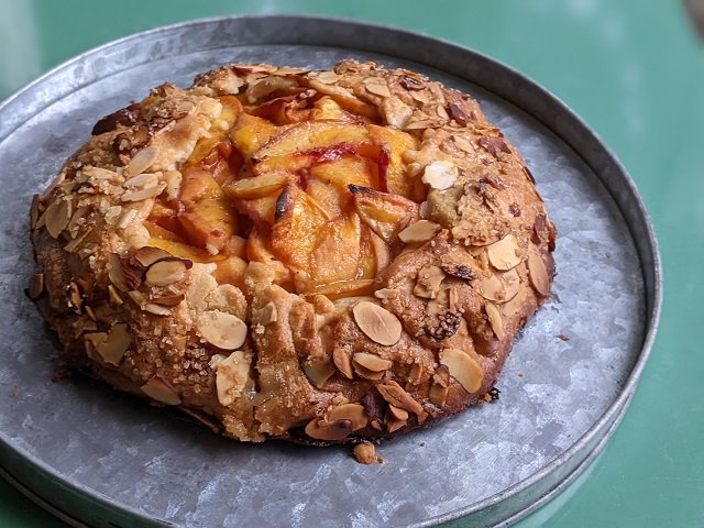 A fruit galette on a baking tin.