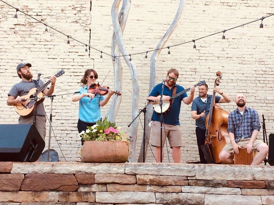 No Name String Band playing on a patio.