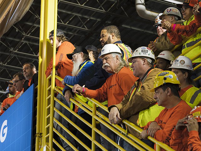 Union workers look on as Biden speaks at the LiUNA Training Center in DeForest on February 8, 2023.