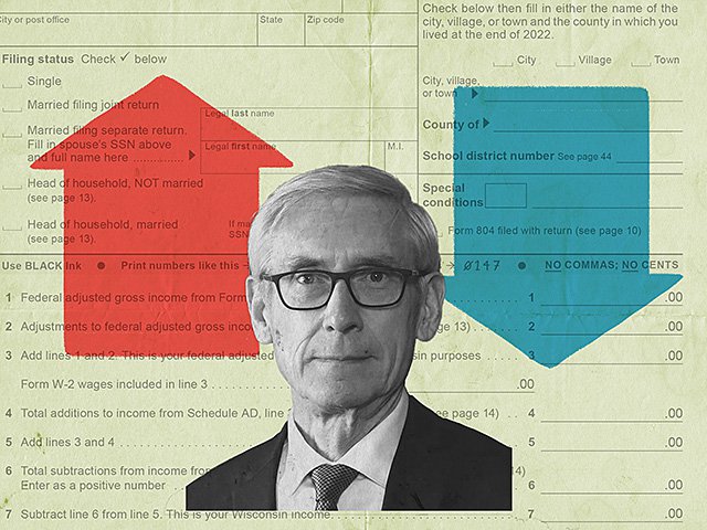 Tony Evers in front of a Wisconsin tax form.