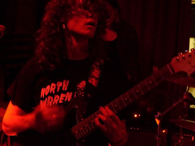 A guitarist for VomBom.