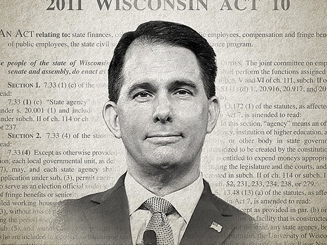 A photo of Scott Walker in front of 2011 Wisconsin Act 10.
