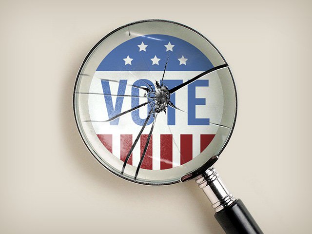 A shattered magnifying glass looking at a "Vote" sticker.