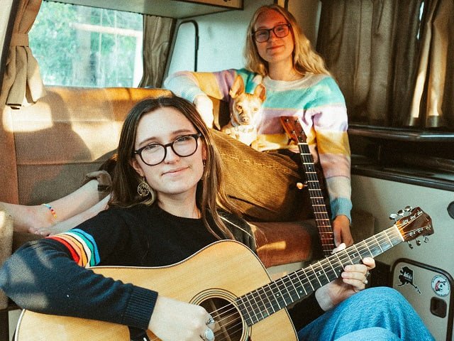 The Cody Sisters in a van.
