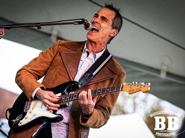 Dave Keller singing and playing guitar.