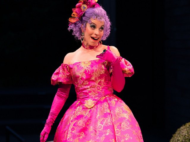 Phoebe González in a hot pink 17th century gown.