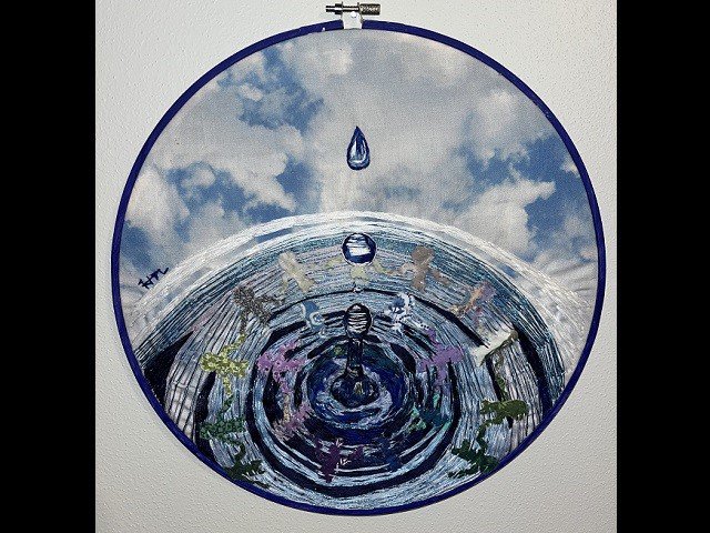 An artwork depicting ripples in water caused by a drip.