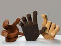 An artist's depiction of hands, made from wood.