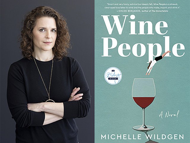 Michelle Wildgen standing with arms folded and a copy of her book Wine People.