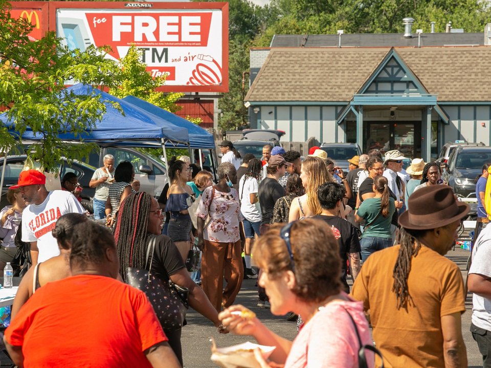 A crowd of people enjoying a past Food Taste Jamboree.