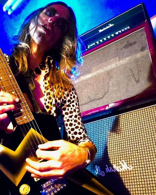 Jason Hartman, a guitar and a stack.
