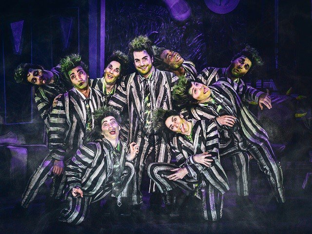Justin Collette (center) and tour company of "Beetlejuice."