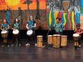 A group of kids drumming.