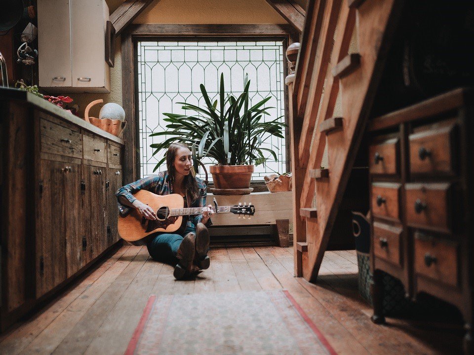 Katie Powderly and a guitar.