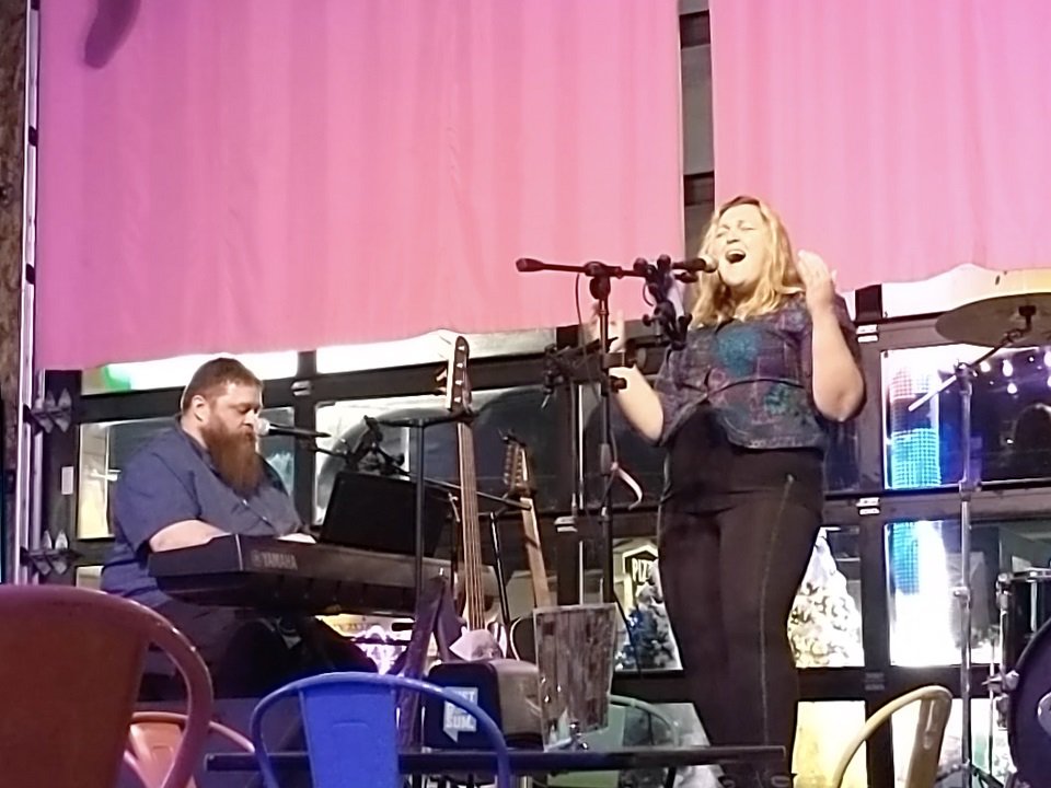 Britton and Sarah on stage.