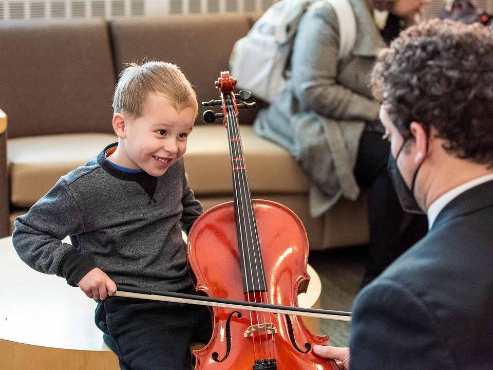 An instrument try-out at a 2022 Wisconsin Chamber Orchestra Family Series concert.