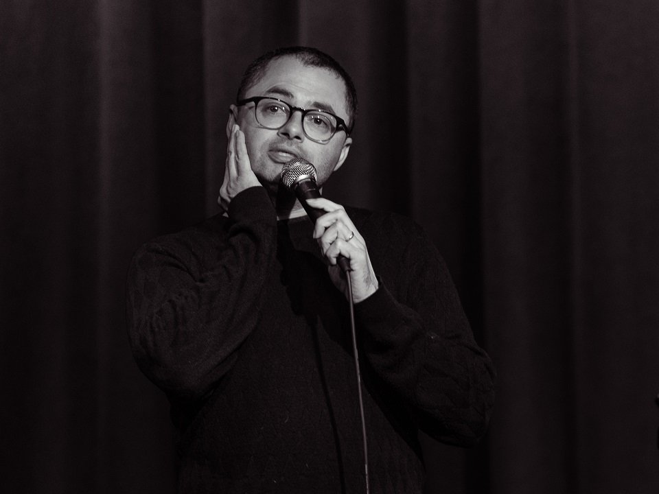 Joe Mande and a microphone.