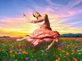 A ballet dancer suspended above a field of flowers.