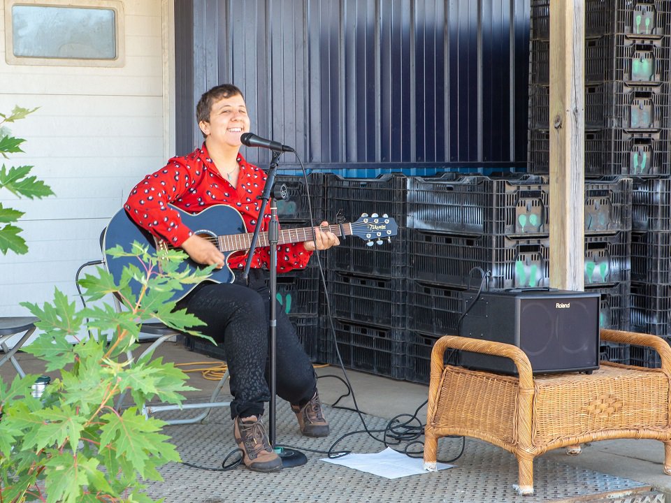 Amanda Jane Hoffman playing guitar.