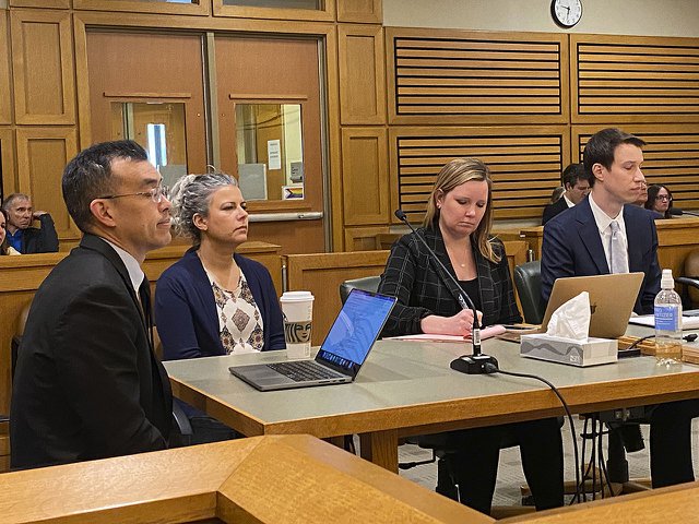 Petitioners Wayne Hsiung and Rebekah Robinson, and attorneys Kristin Schrank and Steffen Seitz (from left).