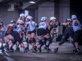 A bout during the 2023 Udder Chaos invitational hosted by Madison Roller Derby.